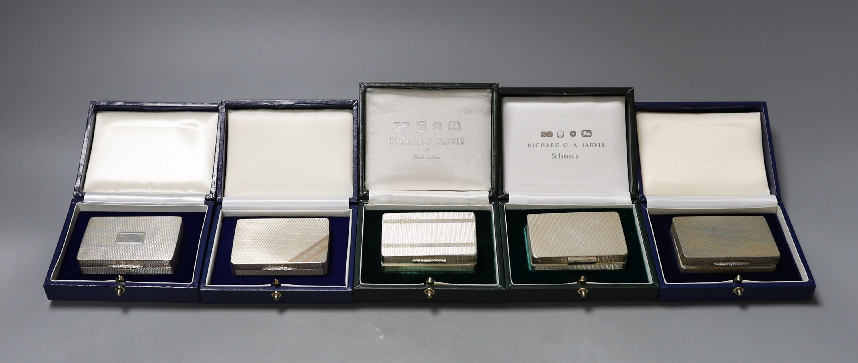 Six assorted modern cased silver or parcel gilt silver pill boxes, by Peter John Doherty, London, 2000-2005 and one Edinburgh, largest 65mm, all in fitted Gallagher boxes.